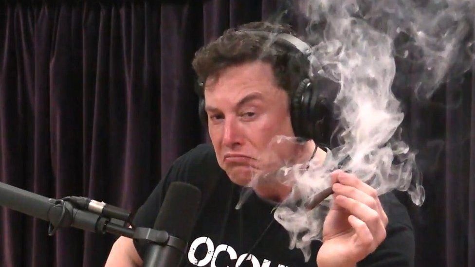 Elon Musk on video podcast smoking a cigar